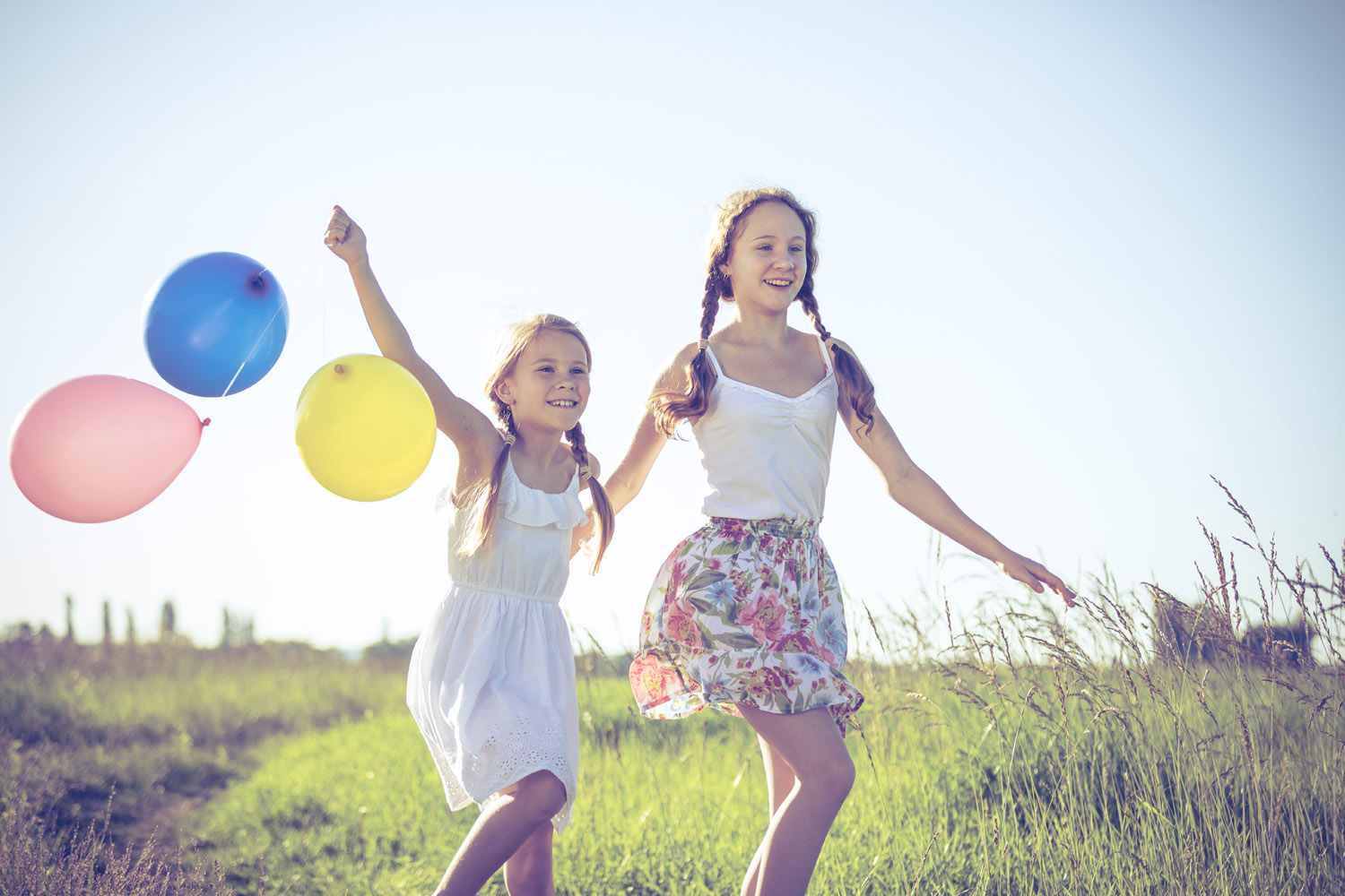 happy-little-children-playing-in-the-field-at-the-pr4dsaw.jpg